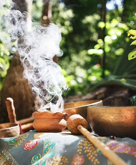 A pot of smoke is sitting on the table.